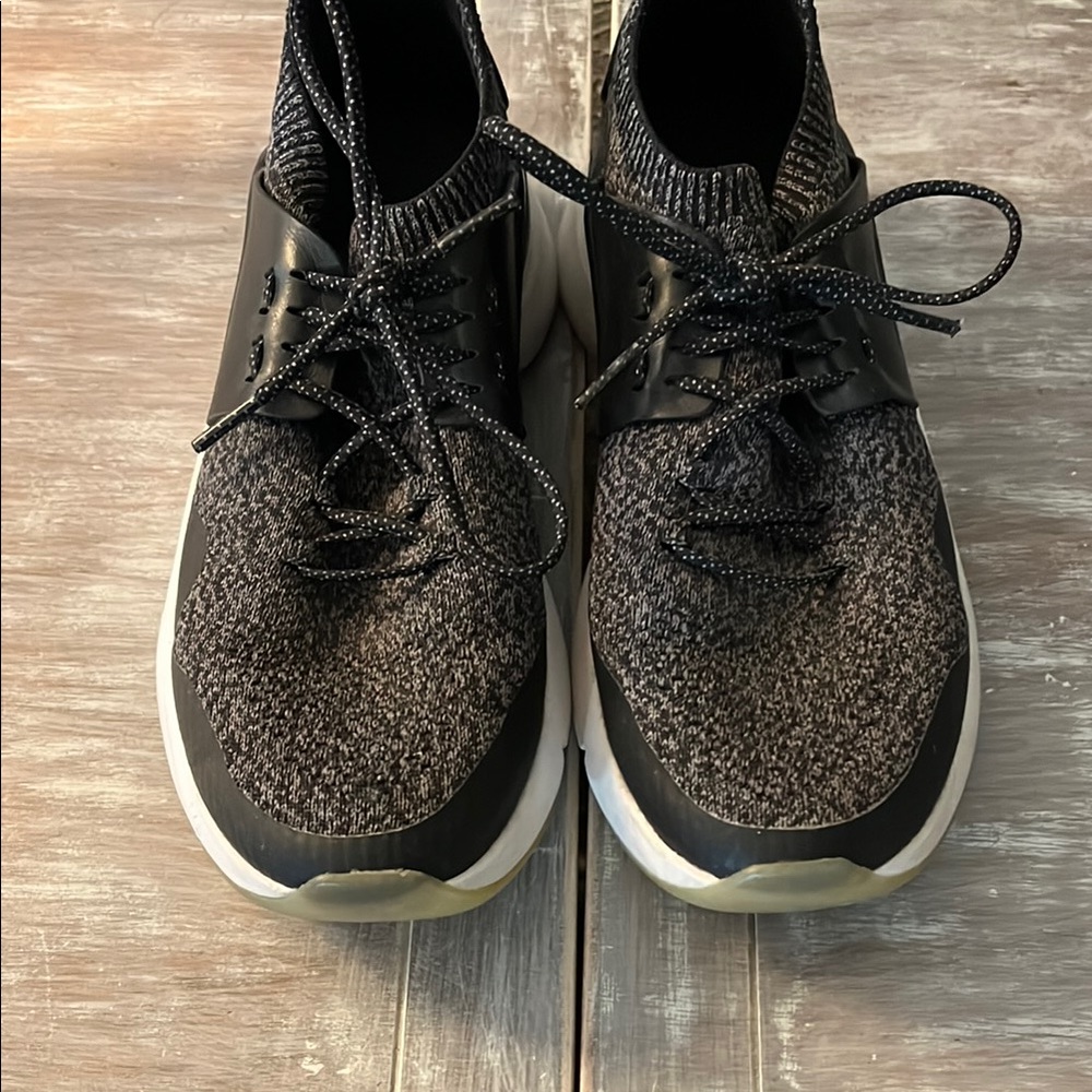 Black knit casual sneaker. Excellent condition. Rarely worn.